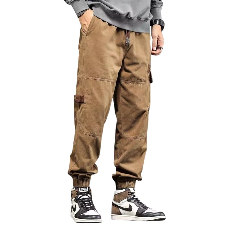 The Vintage Solid Multi Pocket Cargo Pants are the perfect blend of style and functionality. Made from high-quality materials, these pants are designed to last and are perfect for any outdoor or casual occasion. Featuring a classic vintage style, these cargo pants have multiple pockets that provide ample storage space for all your essentials. Features: -90% Cotton, 10% Elastane -Elastic waistband -Multi-pocket design -Slim fit -Street/casual style Casual Cargo Jeans For Fall Outdoor Activities, Fall Outdoor Cargo Jeans In Casual Style, Outdoor Cargo Jeans With Multiple Pockets, Solid Color Cargo Jeans For Fall, Relaxed Fit Cargo Jeans With Multiple Pockets For Outdoor, Fall Solid Cargo Jeans With Pockets, Casual Cargo Pants With Pockets For Outdoor, Combat Pants With Pockets For Fall, Casual Cargo Pants For Outdoor