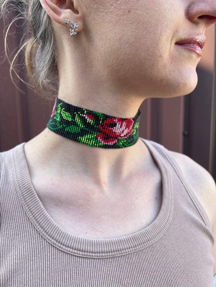 Beaded choker with red flowers. Made from Czech beads. Length 13 inches (33 cm)+Chain extension 2 inches (5cm) Width 1.5 inches (4 cm) >If you want to order such a choker in a different length or color, write to me and I will be happy to make it for you. >Back to my shop: https://www.etsy.com/shop/jewelrybylarisa?ref=seller-platform-mcnav Festival Black Beads Choker, Adjustable Flower Choker With Colorful Beads, Multicolor Flower Choker As Gift, Festival Choker With Round Beads, Unique Tiny Beads Choker Jewelry, Flower Shaped Festival Jewelry With Tiny Beads, Adjustable Flower Choker For Festivals, Flower Beaded Choker Gift, Flower Shaped Beaded Choker As Gift