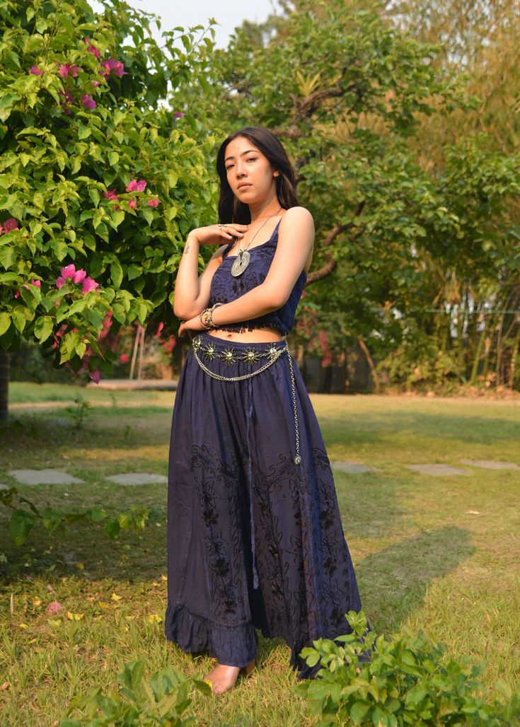 Introducing our Pari Vintage Vibe Blue Top & Maxi Skirt, perfect for embracing boho hippie vibes! This stunning set includes a maxi skirt with a pleated border that adds a touch of elegance and offers a chic, comfortable fit. Crafted with comfort yet elegant fashion in mind, this ensemble is ideal for creating enchanting looks. Choose between two top variations: a halter top or a smocked top, both designed to complement the flowing silhouette of the skirt. Available in various sizes, this set ca Bohemian Wide Leg Maxi Dress For Spring, Hippie Blue Maxi Skirt For The Beach, Bohemian Blue Maxi Skirt For Beach, Bohemian Wide Leg Maxi Dress For Summer, Bohemian Long Skirt For Festival, Bohemian Flowy Floor-length Maxi Skirt, Bohemian Wide Cut Summer Maxi Dress, Bohemian Summer Festival Maxi Skirt, Hippie Boho Print Maxi Skirt For Festivals