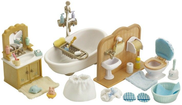 a doll house bathroom with sink, toilet and bathtub