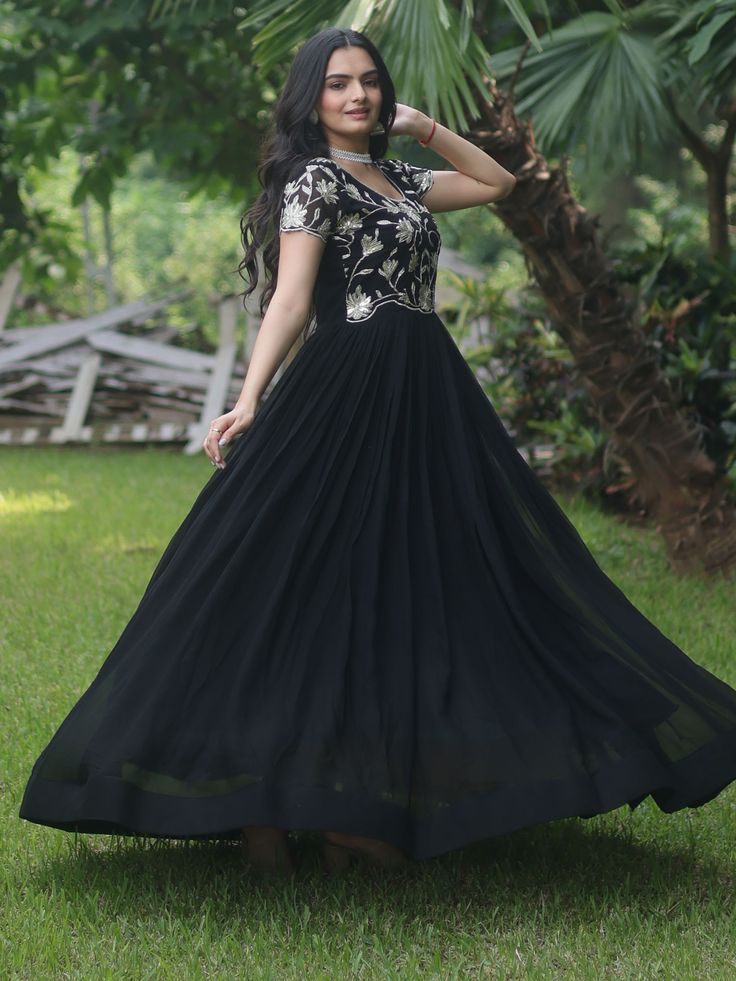 Introducing our stunning "black embroidered georgette reception wear gown" that is sure to make you stand out at any event or function. This black gown features exquisite sequin and embroidered work, adding a touch of elegance and glamour to your look. Crafted from high-quality georgette fabric, this gown is the perfect choice for those special occasions when you want to look and feel your best.
This black reception wear gown is that it comes fully stitched, saving you the hassle of alterations Semi-stitched Embellished Black Anarkali Set, Designer Georgette Gown With Intricate Embroidery, Party Wear Embroidered Dress For Reception, Fitted Georgette Gown With Intricate Embroidery, Fitted Gown With Intricate Embroidery In Georgette, Formal Anarkali Lehenga With Sequins, Black Sequined Full Length Dress, Black Sequined Full-length Dress, Elegant Semi-stitched Embroidered Maxi Dress