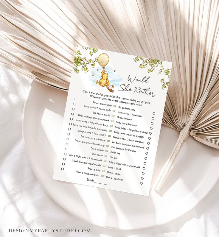 a baby shower checklist sitting on top of a white plate