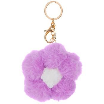 a purple furry keychain with a white square in the center and a gold metal hook