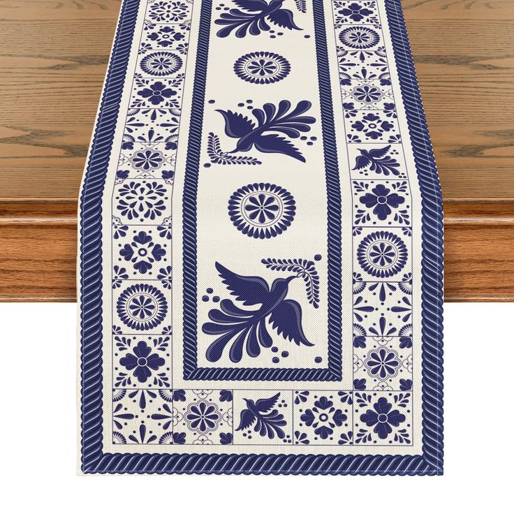 a table runner with blue and white designs on it