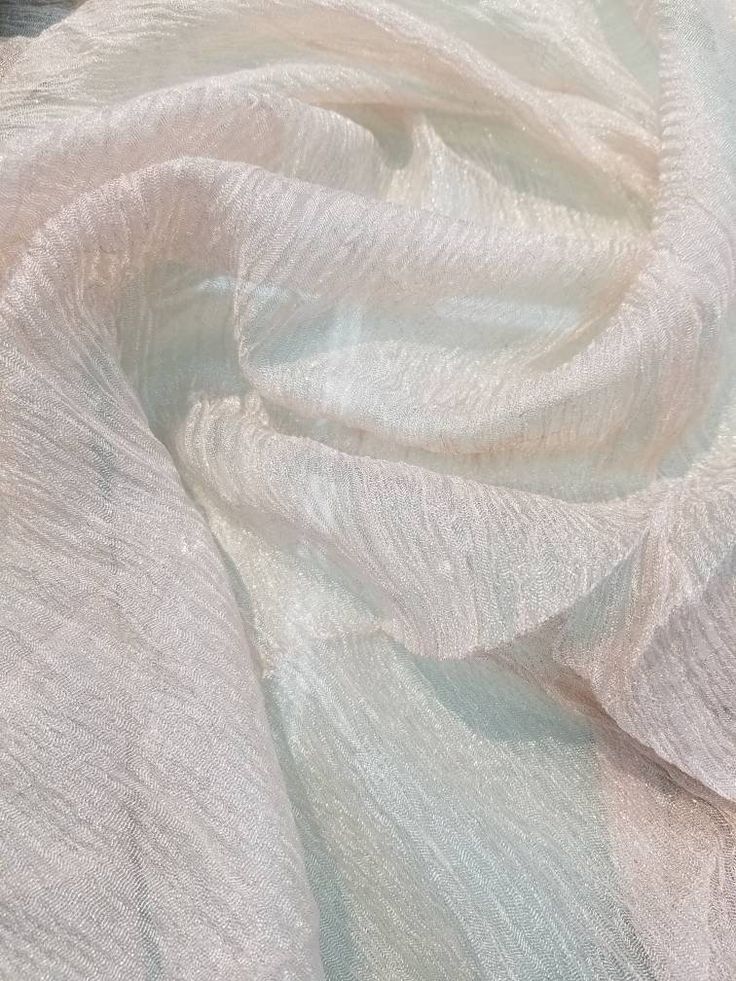 "Metallic off white color krinikled silk organza. 100% Silk Organza. Usable for Apparel and interior designing. End Uses: Apparel,Dresses,Jackets,Slacks,Suits, decorations, blouse, dress etc. Fabric is sold by the yard - to order, select the desired quantity of yards from the drop-down list, each yard will show in your shopping cart as an item but they will ship as one continuous piece Width : 32\" inches Color : Off white Thank you for your coming! Please read policy before placing an order. Pl Elegant Cream Sheer Tulle Fabric, Elegant Beige Tulle Fabric For Party, Elegant Beige Fabric For Wedding, Elegant Beige Wedding Fabric, Elegant White Tulle Fabric For Party, Cream Silk Fabric For Wedding, Elegant Cream Fabric For Wedding, Elegant White Sheer Tulle Fabric, Elegant Shimmer Tulle Fabric For Wedding