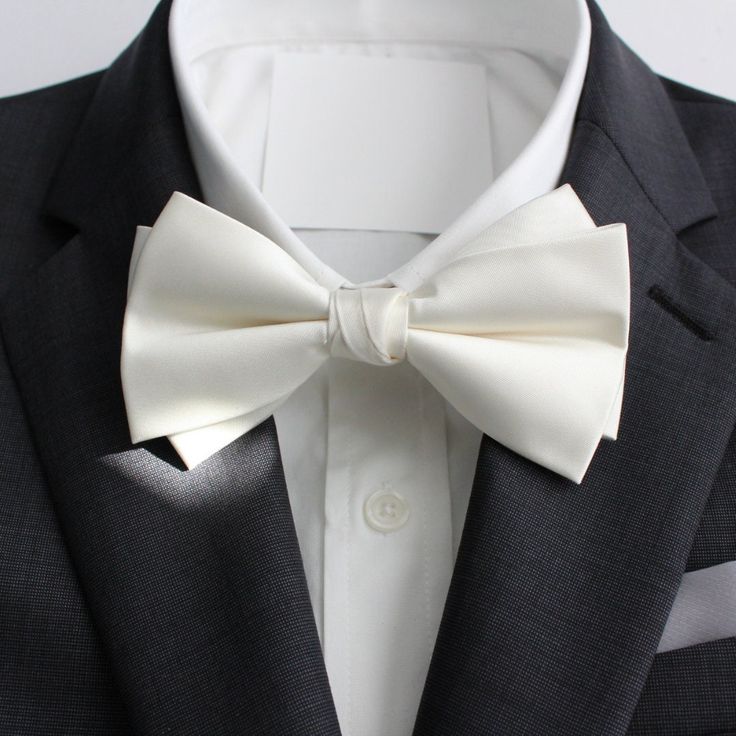 Classy and formal pre-tied and adjustable satin double-deck bow ties for your next formal event. Matches great with suits and tuxedos. Color: Ivory Material: Satin Polyester Adult Pre-Tied Bow Tie: approx. 4.75 inch width by 2.5 inch length Necksize 11.5 inches - 20 inches Metal clasp for secure and comfortable wear. www.tie-mood.com Dapper Wedding Tie In Solid Color, Dapper Solid Color Tie For Wedding, Dapper Solid Color Wedding Ties, Dapper Wedding Tie, Solid Wedding Tie With Satin Bow, Solid Color Wedding Tie With Satin Bow, Dapper Suit And Tie Accessories For Wedding, Satin Tuxedo For Black-tie Events, Classic Satin Ties For Wedding