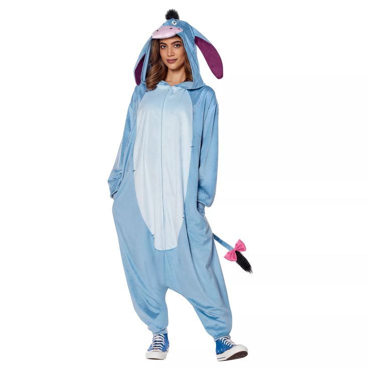 a woman is dressed in a blue bunny costume