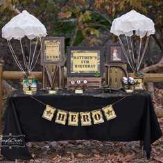 a table topped with two white umbrellas and pictures