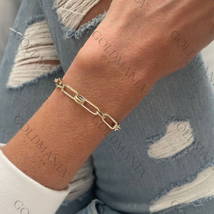 "All Our Bracelets Are Made Of REAL 14K GOLD  14K Yellow Gold Paperclip And Round Link Bracelet, 7.5\" Inch,  5.6 mm Thick, Real Gold Bracelet, Women  Shop our 14K Bracelets https://www.etsy.com/shop/GOLDMANIA?ref=seller-platform-mcnav§ion_id=26925987  Shop On Sale items https://www.etsy.com/shop/GOLDMANIA?ref=seller-platform-mcnav§ion_id=1  Metal: 14K Yellow Gold    Width: 5.6 MM  Length: 7.5 IN  Closure: Lobster claw Weight: 3.20 Gram   Links are hollow   SHIPPED FROM NEW YORK CITY FREE SHIPPING on all orders IN THE US 30 Day Or 14 Day Return Hassle Free  Weight and measurements are approximate and may not be always exactly as stated.  At GoldMania we are first of all committed to environmental responsibility. We guarantee that the gold we use is strictly ecofriendly and of the highest q Box Chain Bracelets With Rectangular Links, Anniversary Gold Bracelet With Solid Link Construction, Yellow Gold Chain Link Diamond Bracelet For Gift, Gold Link Diamond Bracelet, Luxury Gold Link Tennis Bracelet, Formal Gold Link Tennis Bracelet, Gold Chain Link Bracelet With Box Chain, Gold Link Tennis Bracelet With Solid Construction, Gold Link Bracelets For Anniversary