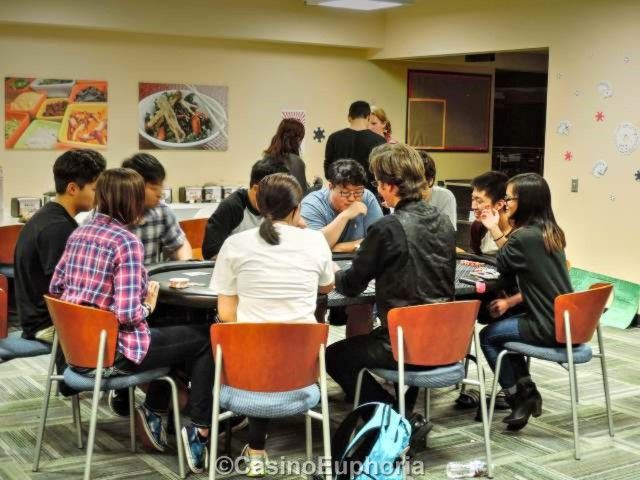 a group of people sitting around a table together