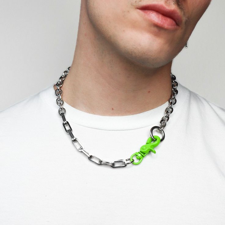 This necklace is made of hand mended double link paperclip chain and smooth cable chain. The highlight of this design is the lime green painted clasp that connects both elements together. This necklace is finished off with a swivel lobster clasp closure. The cable chain can be fully adjusted depending on how tight or loose you would like to wear it. This piece exudes modern warehouse grunge, and is great as a fashion accessory or rave essential. Materials: Stainless steel Measurement: 21 inches Trendy Streetwear Necklace With Adjustable Chain, Punk Jewelry With Adjustable Chain For Streetwear, Adjustable Link Chain Necklace For Streetwear, Green Metal Chain Necklace With Adjustable Chain, Punk Style Adjustable Chain Necklace For Streetwear, Punk Style Necklace With Adjustable Chain For Streetwear, Adjustable Metal Chain Necklace For Streetwear, Grungecore Aesthetic, Grunge Necklaces With Adjustable Chain For Streetwear