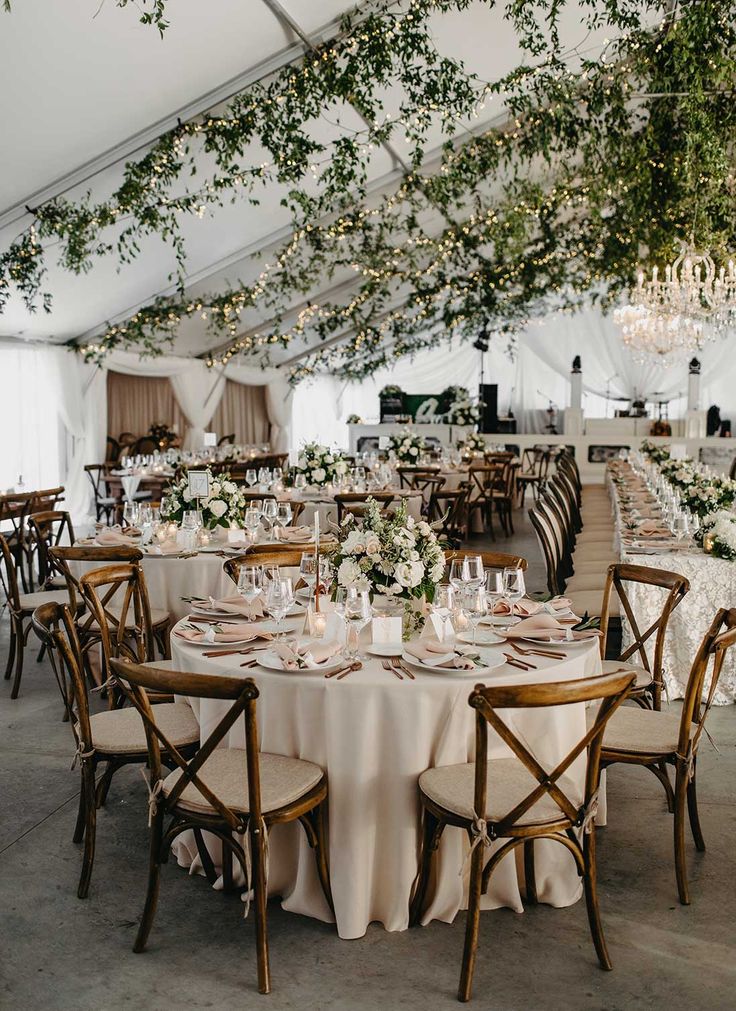 a large tent with tables and chairs set up for an event