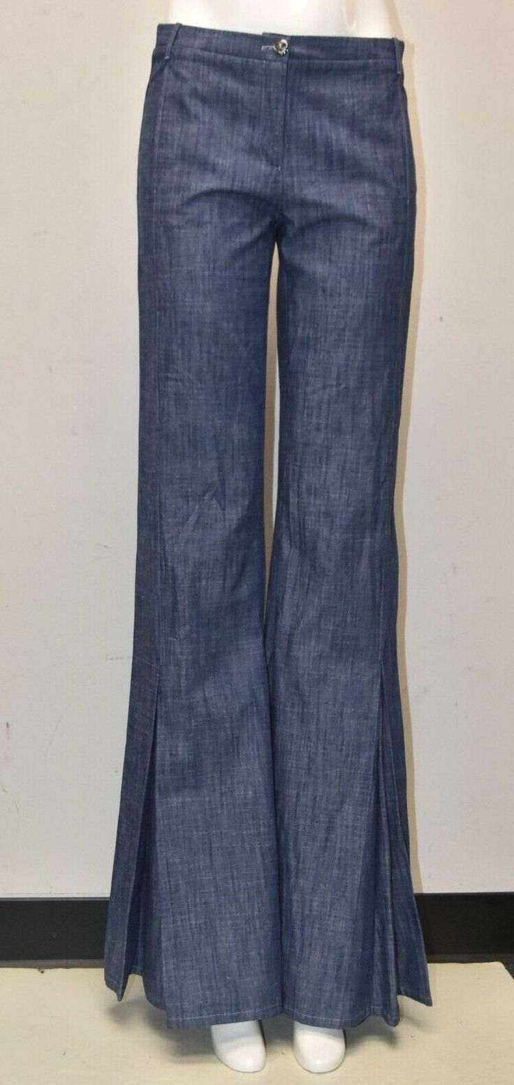 Brand new with tags  100% Authentic  Chanel Pants in Blue So elegant and graceful in the most gorgeous BLUE color!!!! They will flatter the figure perfectly! GORGEOUSLY constructed in light weight denim with long silhouette! COMPOSITION: is: 98 % cotton, 2% spandex Available in size 36 Waist 145" ( around 29" ), Hip 17.75" ( around 35.5" , Inseam 38" , Rise 8.75" Totally Sold out!!! MAGNIFICIENT!  CRUISE COLLECTION!! THE JEANS ARE BRAND NEW, NEVER WORN, PERFECT PRISTINE CONDITION. MADE IN ITALY Indigo Full Length Bottoms For Summer, Elegant Blue Flare Bottoms, Elegant Denim Blue Bottoms With Pockets, Indigo Full Length Pants For Spring, Indigo Fitted Wide Leg Pants, Elegant Medium Wash Denim Bottoms, Fitted Indigo Wide Leg Pants, Fitted Wide Leg Indigo Pants, Indigo Wide Leg Fitted Bottoms