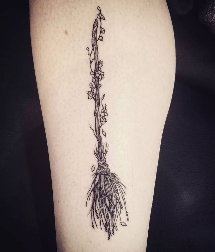 a black and white photo of a plant on the thigh with flowers growing out of it