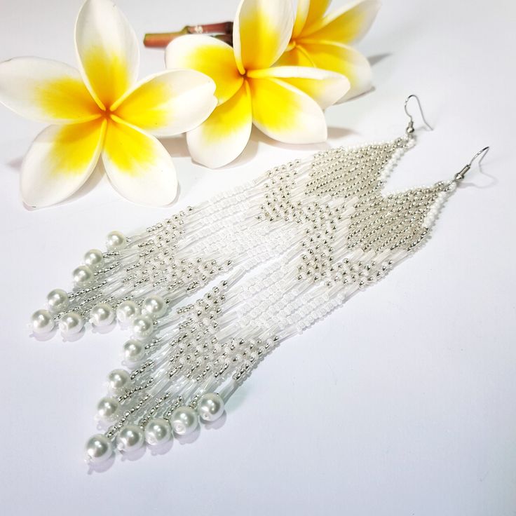 Silvery White Very Long Fringe Earrings. Sparkling, Gentle, Seed Beads Earrings. Indian Jewelry. Boho Style/ Waterfall earrings.These earrings are perfect for a wedding dress.Gradient bead earrings.Boho style Seed Beads earrings. Long Earrings. Beautiful,Sparkling, Elegant Earrings .A beautiful Christmas gift for women and girlfriend. These are long but not heavy earrings. Length of earrings 14 cm (5.50 inches). Width of earrings 0.78 inches. Materials;Czech seed beads.Czech Crystals.Japanese se Bohemian Silver Pearl Earrings For Gifts, Silver Bohemian Pearl Earrings For Gifts, Beaded Bohemian Chandelier Earrings For Party, Handmade Silver Beaded Earrings For Party, Bohemian Silver Dangle Pearl Earrings, Bohemian Silver Pearl Drop Earrings, Silver Handmade Beaded Earrings For Party, Silver Bohemian Pearl Drop Earrings, Bohemian Beaded Chandelier Earrings For Party