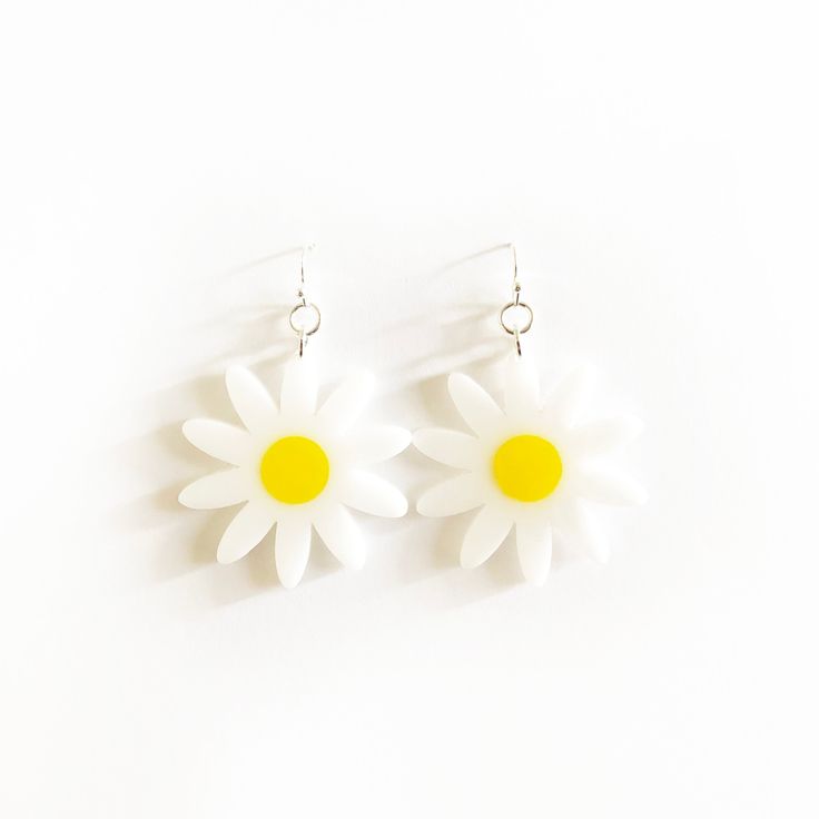 "x WHITE AND YELLOW DAISY EARRINGS x White and yellow daisy earrings with silver earring hooks.  x All acrylic is 1/8\" thick x Silver earring hooks x Please allow 5-7 business days for make + shipping." Yellow Hypoallergenic Flower-shaped Earrings, Trendy White Daisy-shaped Jewelry, Trendy White Daisy Shaped Jewelry, Summer White Hypoallergenic Jewelry, Hypoallergenic White Summer Jewelry, Summer Hypoallergenic White Jewelry, Summer White Nickel-free Flower Earrings, White Nickel-free Flower Earrings For Summer, Summer White Nickel-free Earrings