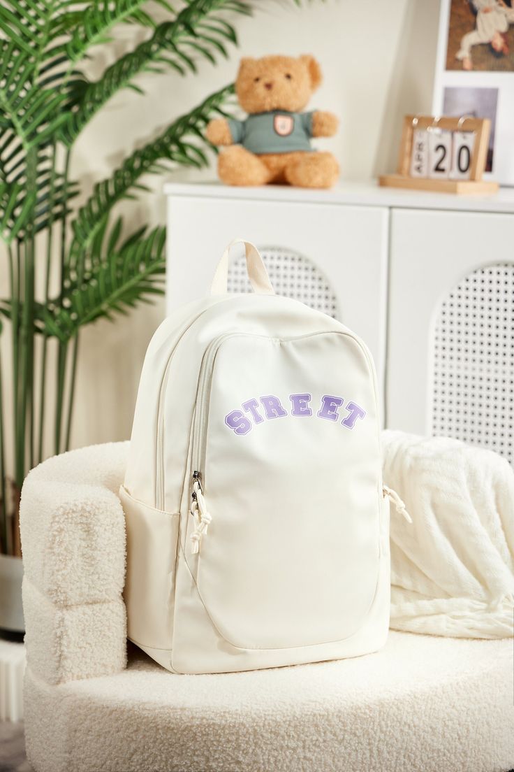 【Product Information】The backpack measures 17.72*7.48*12.99 inches/45*19*33 cm and weighs only 0.4 kg/0.88 lbs. It is available in stylish date red, beige, purple, light dark/gray, and blue, with a minimalist appearance. 【Large Capacity Design】The main compartment of the backpack features two slip pockets and a dedicated compartment for 15.6-inch laptops, allowing you to organize all your devices neatly and securely. There is a front zippered pocket and two side pockets. The back has an anti-the Large Capacity Softback Backpack For Students, Trendy Student Backpack With Letter Print, Large Capacity Backpack For Back To School, Trendy Daily Backpack With Letter Print, Trendy Daily Use Backpack With Letter Print, Everyday White Backpack With Letter Print, Casual Letter Print Standard Backpack, Trendy Letter Print Standard Backpack, Rectangular Backpack With Letter Print For Daily Use