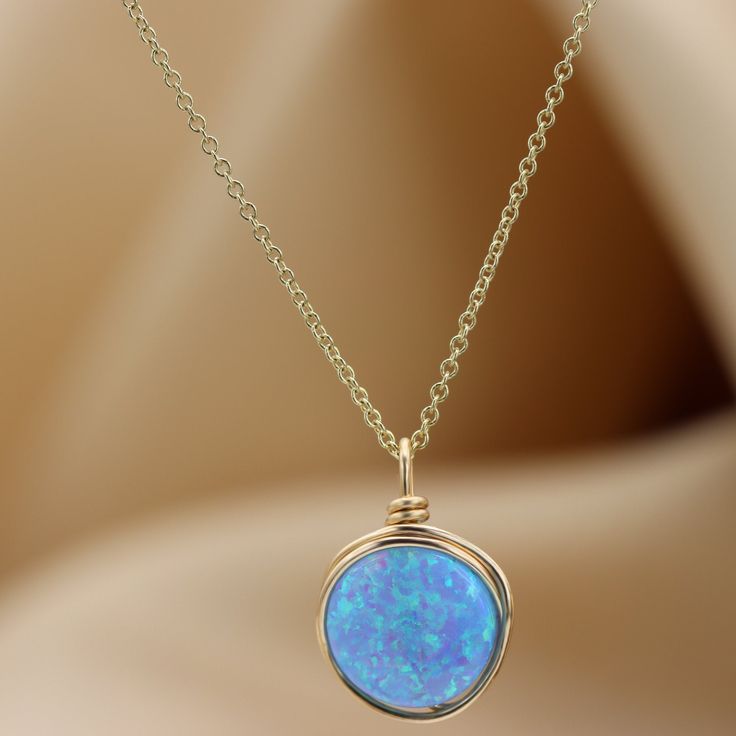 A beautiful large Opal necklace is the perfect statement piece. Set with a genuine 10 mm blue Opal gemstone Most recommended as a set with our beautiful Blue Opal ring :) Link: https://www.etsy.com/il-en/listing/879805308/blue-opal-knot-ring-handmade-ring-opal?ref=shop_home_active_5&pro=1&frs=1 ☆ WHY THIS PIECE OF J E W E L R Y IS AWESOME! ☆ * Hand finished and made from high quality raw materials * Available in Gold filled, Red gold Filled or Sterling Silver * Long lasting beauty & Gold Opal Round Necklaces, Gold Opal Round Necklace, Gold Opal Jewelry With Round Stone, Elegant Blue Jewelry For Birthday Gift, Opal Birthstone Necklaces, Round Opal Birthstone Necklaces, Opal Birthstone Round Necklaces, Blue Gemstone Jewelry For Birthday Gift, Elegant Blue Necklace For Birthday Gift