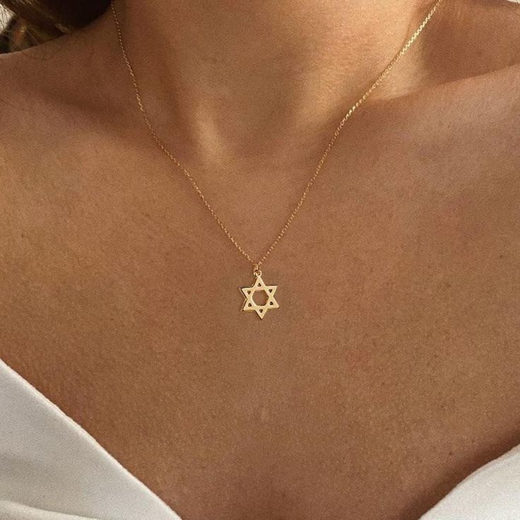 Product Details: Material: Brass, 14k Gold Plating Metal Type: Brass, 14k Gold Plated Clasp Type: Lobster Chain Type: Cable Measurements: 16.5" Plus 1.9" Extension Pendant Is 33mm Embrace Timeless Elegance With Our Star Of David Necklace. Crafted With Exquisite Precision, This Symbol Of Faith And Heritage Shines Brightly, Adorned With Delicate Details. Wear It Close To Your Heart, A Beautiful Reminder Of Tradition, Unity, And Strength. Elegant Star Of David Charm Necklace With Delicate Chain, Gold Star Of David Charm Necklace With Delicate Chain, Elegant Gold Star Of David Charm Necklace, Elegant Yellow Gold Star Of David Charm Necklace, Gold Star Of David Necklace With Birthstone, Gold Minimalist Star Of David Charm Necklace, Dainty Star Of David Charm Necklace For Gift, Minimalist Gold Necklace With Star Of David, Gold Engraved Star Of David Necklace