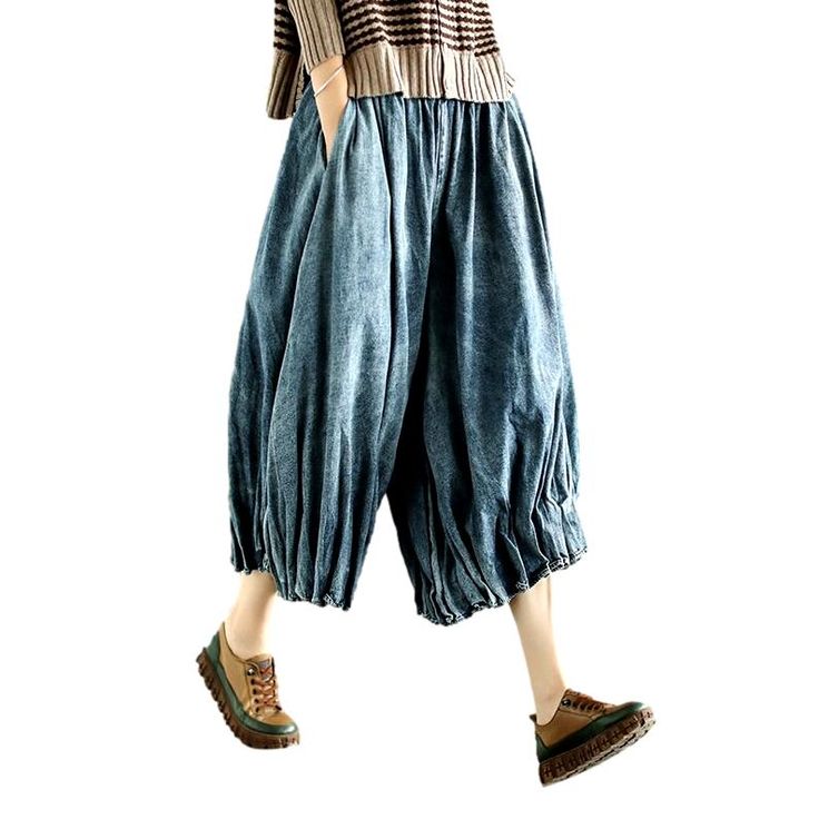 Rediscover the essence of y2k fashion with our pleated culottes denim pants from our 2023 Spring Collection! Crafted from luxe denim with a high-waisted silhouette. these vintage-inspired gaucho feature a unique folded design that adds a touch of sophisticated finesse. A zipper closure ensures comfort and effortless style. making these pants a must-have for the fashionista in you!Why This Piece Is a Wardrobe StapleStrike the perfect balance between retro and modern trend with these timeless culo Spring Wide Leg Dark Wash Cropped Jeans, Spring Baggy Medium Wash Cropped Jeans, Summer Baggy Pleated Bottoms, Spring Baggy Dark Wash Cropped Jeans, Spring Baggy Blue Cropped Jeans, Spring Blue Baggy Cropped Jeans, Spring Pleated Wide Leg Pants, Trendy Cropped Wide Leg Cotton Pants, Spring Baggy Ankle-length Jeans