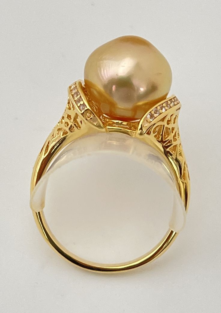 Luxury Gold Topaz Ring, Luxury Gold Pearl Ring With High Luster, Luxury Gold Rings With High Luster, Luxury High Luster Gold Pearl Ring, Luxury High Luster Gold Rings, Gold Rings With High Luster, Luxury Gold Topaz Ring For Anniversary, Fine Jewelry Gold Pearl Ring With Gemstone, Elegant Gold Hallmarked Topaz Ring