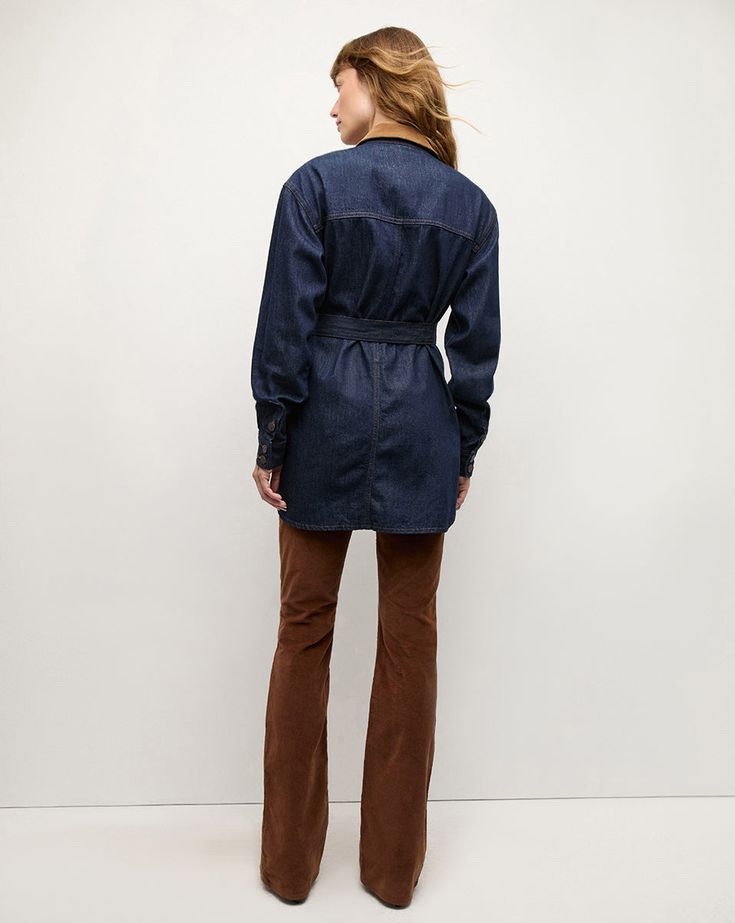 Made in the USA from 100% cotton, the Mikaela is a denim shacket with a relaxed, elongated fit. Finished with a corduroy collar, safari pockets, and a self-tie belt at the waist, this is a versatile layer to take you through the seasons.100% CottonMade in USATurn inside out and machine wash cold. Hang to dry.Style #J24097571089ID Corduroy Button-up Denim Jacket With Pockets, Indigo Button-up Denim Jacket, Indigo Denim Button-up Jacket With Patch Pockets, Indigo Cotton Button-up Shirt, Unstructured Indigo Button-up Shirt, Plus And Minus, Belt Tying, Veronica Beard, Inside Out