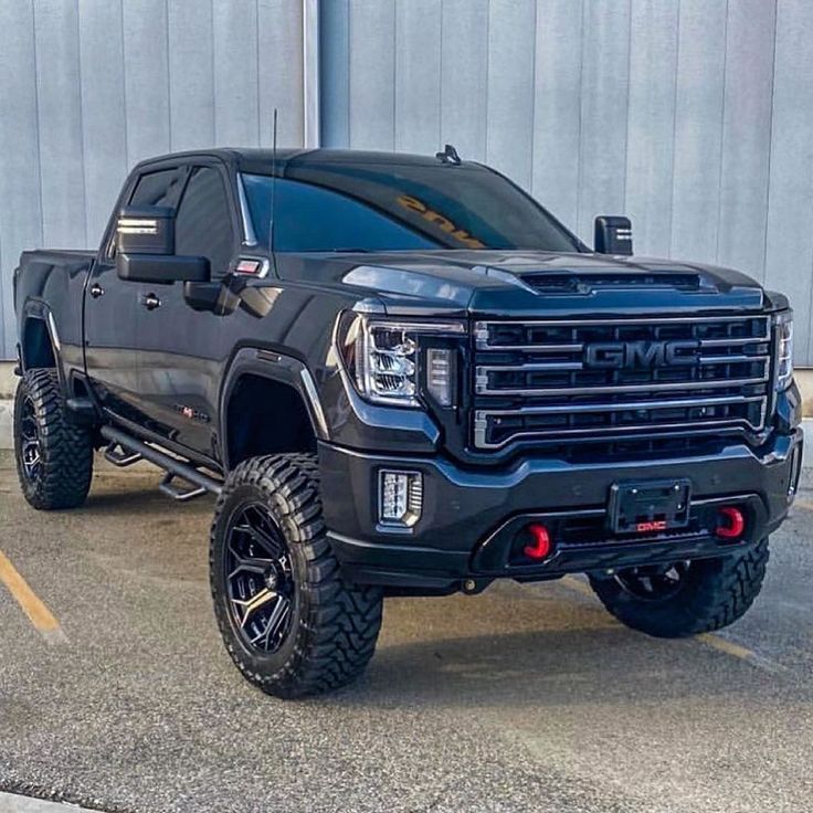 a black truck parked in front of a building