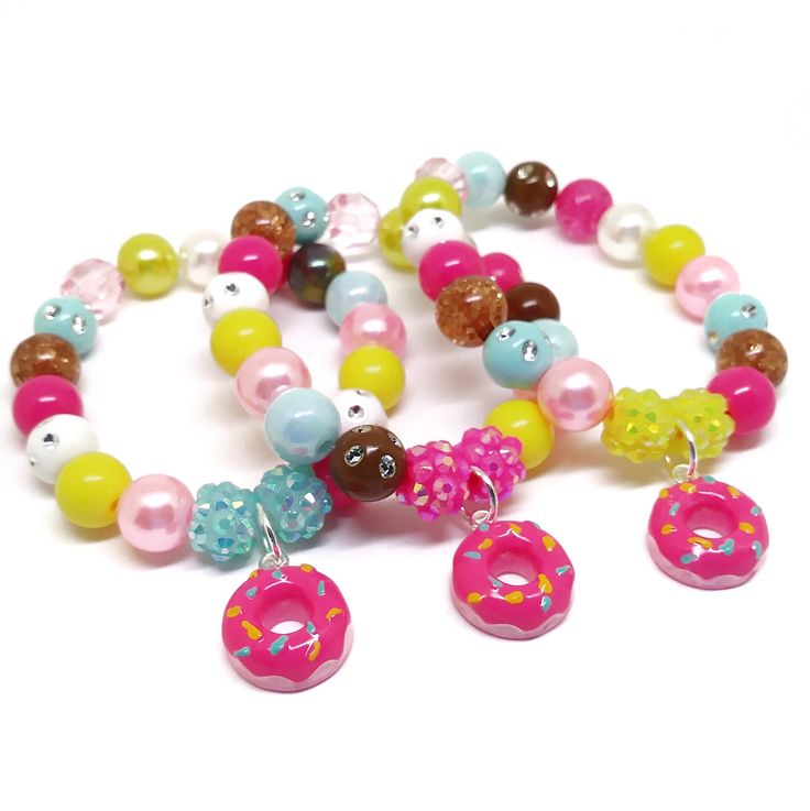 These adorable bracelets are the perfect favor for your little one's butterfly themed party! Each bracelet features an enameled butterfly charm, resin rhinestone beads and an assortment of light purple, aqua, lake blue and pink 10mm acrylic beads strung with durable stretch floss cord. Each bracelet comes individually packaged in organza bags. Please message me if you have any questions or if you would like to make some changes to this item. Upgrade to fun diy bracelet kits here https://www.etsy Pink Beaded Jewelry For Party Favors, Playful Beaded Charm Bracelet For Birthday, Pink Round Beads Bracelets For Party Favors, Pink Bracelets With Round Beads For Party Favors, Pink Novelty Stretch Bracelet For Birthday, Pink Novelty Plastic Bracelets, Novelty Pink Stretch Bracelet For Birthday, Pink Plastic Novelty Bracelets, Playful Pink Charm Bracelets