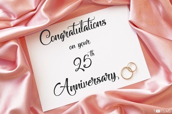 congratulations on your 95th anniversary card with two gold wedding rings laying on pink satin