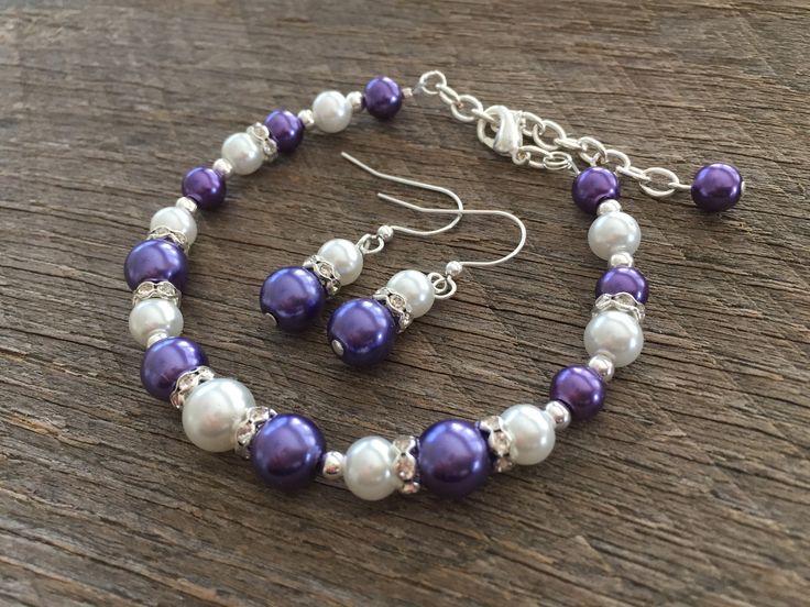 "Plum Purple and White Pearl And Crystal Bracelet and Earring Set with Crystal Rhinestone Rondelles on Silver or Gold Chain with Lobster Claw Hook Please select primary color form drop down. Secondary color will be white unless specified in \"note to seller\" section at checkout. Length: Hooks to fit 5.5 to 8 inch wrist. If you need a custom size, please feel free to contact me. Expedited shipping available at checkout. *Shipping Note: -United States residents - If you are ordering less than two Purple Wedding Bracelet Jewelry, Purple Wedding Bracelet, Simple Pearl Necklace, Flower Girl Jewelry, Bracelet And Earring Set, White Pearl Bracelet, Pink Pearl Necklace, Simple Pearl, Ball Bracelet