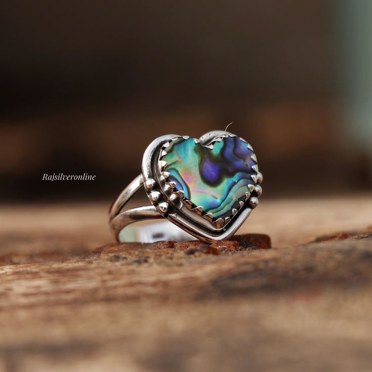 Abalone Shell Ring, Heart Shape Ring, 925 Sterling Silver Ring, Unique Ring, Handmade Ring, Silver Artisan Ring, Wedding, Gift For Her Metal: 925 Sterling Silver Gemstone : Abalone Shell  Stone Color : Multi Stone Shape : Heart Stone Setting: Bezel Benefits of wearing Rainbow moonstone:- Rainbow moonstone is thought to bring balance, harmony and hope while enhancing creativity, compassion, endurance and inner confidence. Rainbow moonstone is believed to help strengthen intuition and psychic perc Handmade Silver Heart-shaped Rings, Handmade Silver Heart Rings, Handmade Sterling Silver Heart Ring For Promise, Handmade Sterling Silver Open Heart Ring, Handmade Sterling Silver Heart Promise Ring, Handmade Heart Shaped Silver Rings, Handmade Sterling Silver Heart Ring For Wedding, Handmade Heart-shaped Sterling Silver Ring, Handmade Heart Cut Ring For Anniversary