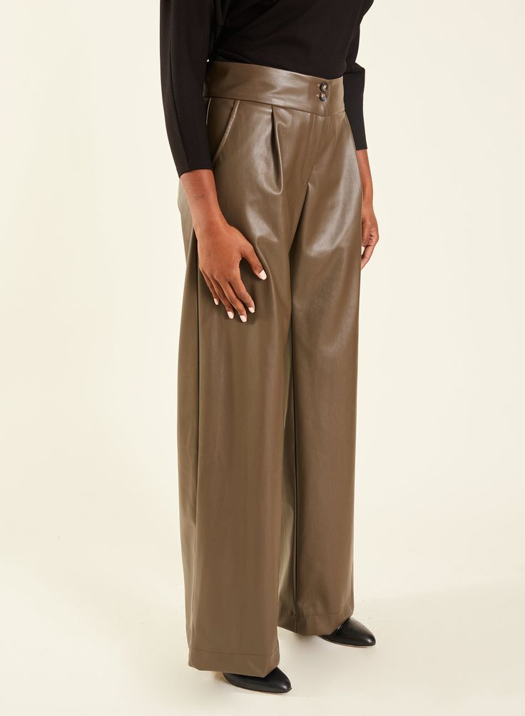 This style features: Mid-rise waist Wide leg Pleated trouser Front pockets Fly front with zipper and two buttons Fabric content: 100% PU outer Dry clean or hand wash only Style tip: Chic and effortless, show off your French side in Blu's Pant, and take it up a notch in pleather! Perfect for late nights out, chilly weekends, or simply looking like you have somewhere to be. Also available in Black Pleather. SIZING This style fits true to size. Size up for a slightly looser fit. Kayla is 5'9, has a 26" waist, and is wearing a size S. Designed by Meg in Brooklyn, NY. Made in the USA. Nylon Wide-leg Pants With Pockets, Khaki Wide-leg Parachute Pants With Side Pockets, Luxury Straight-leg Parachute Pants With Multiple Pockets, Khaki Wide-leg Parachute Pants With Patch Pockets, Brown Wide-leg Parachute Pants With Side Pockets, Ethical Shopping, Fashion Prints, Mid Rise, Night Out