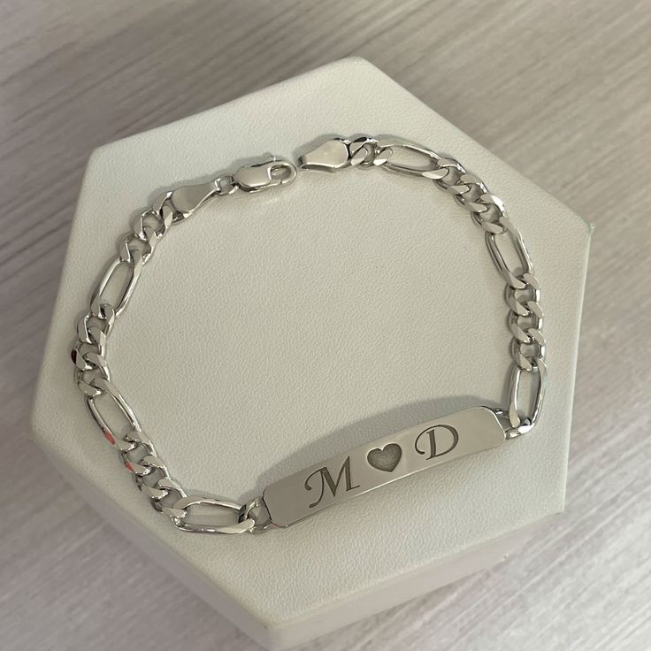 Personalized nameplate bracelet in sterling silver. We can engrave names, initials or any words that you would like on top of or even inside the bracelet. These bar bracelets are very cute and durable. The chain style is Figaro chain Surprise your loved ones with a great gift for his birthday, Christmas, Father's Day, or any other occasion. It takes 14 to 21 business days ♥ The most unique jewelry you can find, perfect gift for you and your loved one. ♥ All our jewelry is custom made by hand wit Luxury Initials Bracelet For Anniversary, Silver Bracelets For Men With Name, Adjustable Sterling Silver Bracelet For Anniversary, Sterling Silver Nameplate Jewelry With Initials, Sterling Silver Charm Bracelet With Initials In Silver, Personalized Nameplate Jewelry With Polished Finish, White Gold Initials Nameplate Jewelry, White Gold Nameplate Jewelry With Initials, Silver Charm Bracelet With Initials As Gift