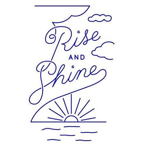 the words rise and shine are drawn in blue ink on a white background with an image of