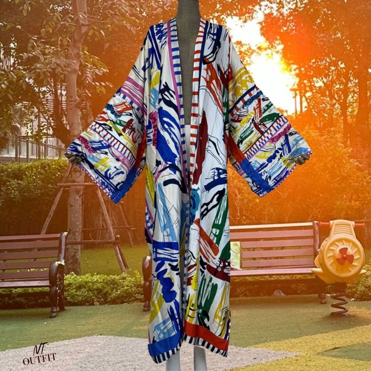 Summer kimono beach wear women dress beach cover up Cardigan boho maxi coat abayas Graffiti print kaftan, Oversized Kimono, Holiday Look * Style: Young Style * Material: Polyester * Young Style: Bohemian * Size: length 145cm (57 inches)/ bust: 130 cm/51.2 inches * Note:. 1. Please help me check size before ordering. Because Items measured by hands; they may be 2-4cm differences. (All measurement in cm and please note 1cm=0.39inch 1 inch=2.54cm ) 2. Because of lighting effects, the color of shirt Long Printed Beach Dress For Beach Cover-up, Open Front Maxi Dress For Beach Cover-up, Oversized Maxi Dress For Spring Vacation, Oversized Long Sleeve Maxi Dress For Vacation, Long Summer Festival Kimono, Oversized Beachwear Maxi Dress For Beach Season, Free Size Long Sleeve Beach Dress For Summer, Summer V-neck Beachwear Robe, Summer Boho Print Maxi Kimono