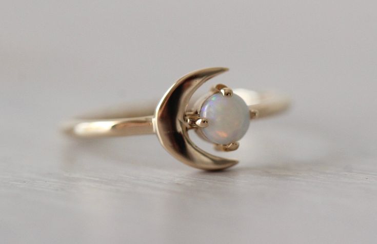 "We love this ring to the moon and back! Our 14K \"Moon of My Life\" ring is available in your choice of yellow, white or rose gold and features a dreamy crescent moon emphasized by a lovely Birthstone of your choice. One of our most popular rings! - Gemstone Measures 4mm across - Available in 14K rose, yellow or white gold - Round Band measure 1.3mm - Moon measures 8.5 mm in length Stone options- 1. Rhodolite Garnet (January- Rose Cut) 2. Amethyst (February- Rose Cut) 3. Aquamarine (March- Smoo 14k Gold Opal Ring, Moon Of My Life, Ring Moon, Life Ring, Rings Gemstone, Popular Rings, Ring Birthstone, Moon Ring, Rhodolite Garnet