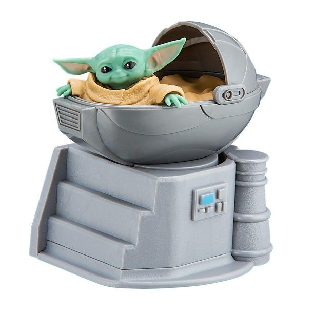 the child yoda toy is in an electronic device