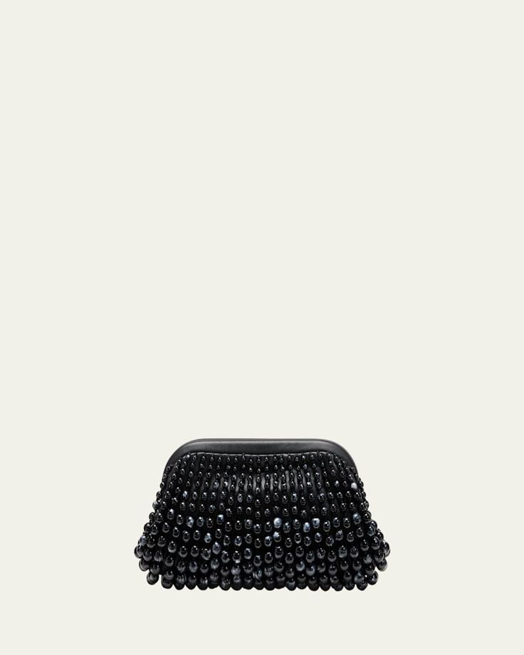 Cult Gaia "Nia" clutch bag in beaded acrylic and leather     Structured top with hinge closure     Lining: Polyester/polyurethane    Approx. 6.5"H x 12.5"W x 3"D    Imported Beaded Top Handle Evening Bag, Handheld Beaded Clutch, Chic Beaded Handheld Clutch, Evening Handheld Beaded Clutch, Chic Beaded Pouch Clutch, Top Handle Clutch With Removable Pouch For Events, Beaded Handheld Clutch For Events, Evening Clutch With Pearl Handle, Formal Handheld Beaded Clutch