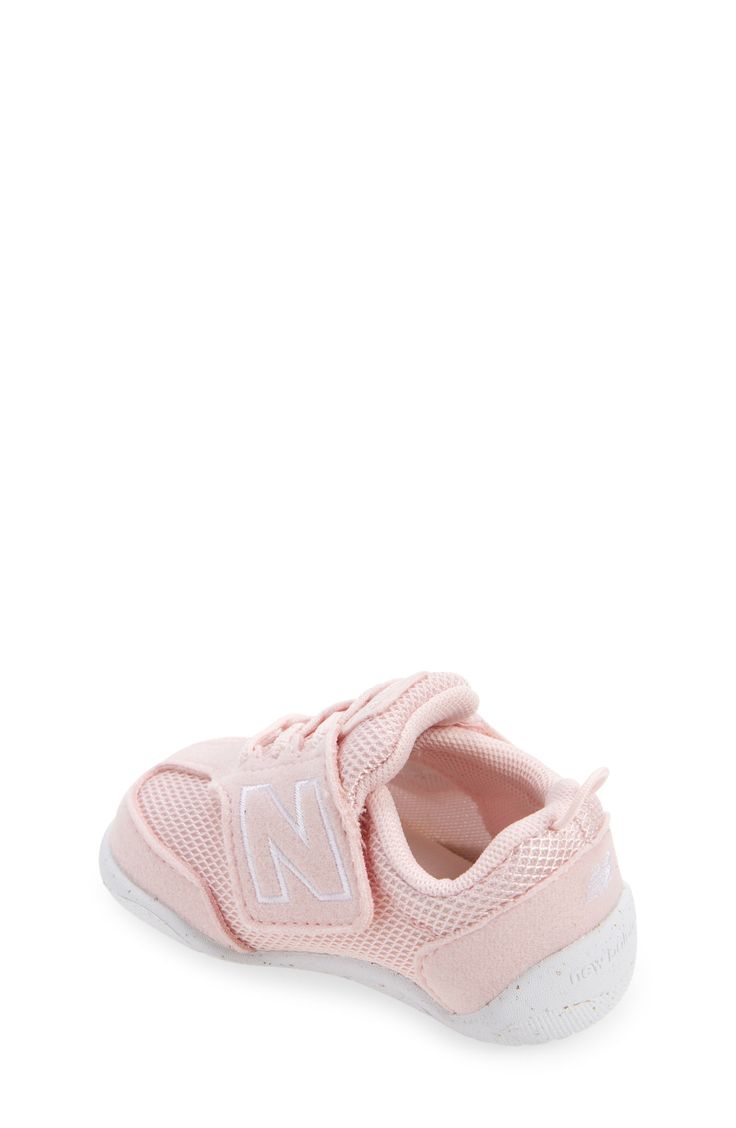 Baby's first steps will be supported in this sporty sneaker featuring a roomy toe box and easy-on/off strap. Adjustable hook-and-loop strap Removable insole Textile and leather upper/synthetic lining/rubber sole Imported Sporty Breathable Sneakers For Playtime, Sporty Breathable Sneakers For Casual Wear, Sporty Slip-resistant Sneakers For Playtime, Pink Slip-resistant Training Sneakers, Sporty Non-slip Sneakers For Playtime, Slip-resistant Round Toe Sneakers For Playtime, Pink Scratch-resistant Sneakers For Sports, White Slip-resistant Sneakers For Playtime, Breathable Sneakers With Round Toe For Playtime