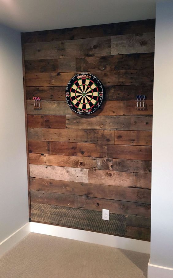 a dart board mounted to the side of a wall