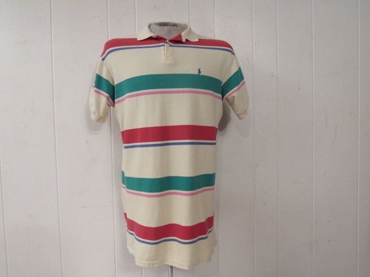 "Vintage 1980s or 90s color block striped cotton polo shirt. Made in the U.S.A. by Polo Ralph Lauren. Has embroidered Polo horse and jockey on chest. Size medium. Actual measurements are: 43\" at the chest 42\" at the waist 18.5\" shoulder seam to shoulder seam 31\" overall length In very good condition." Cotton Polo Shirt With Vertical Stripes, Cotton Short Sleeve Polo Shirt With Vertical Stripes, Cotton Polo Shirt With Vertical Stripes For Summer, Striped Cotton Polo Shirt For Spring, Summer Cotton Polo Shirt With Vertical Stripes, Spring Striped Cotton Polo Shirt, Casual Multicolor Polo Shirt With Striped Collar, Casual Striped Polo Shirt, Multicolor Cotton Polo Shirt With Striped Collar