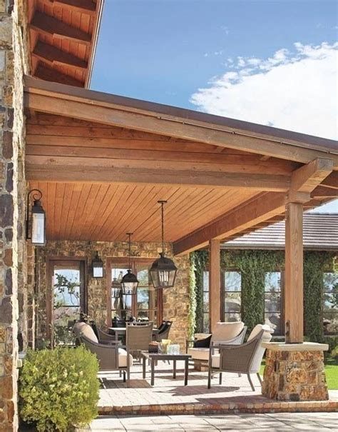 a covered patio with chairs and tables