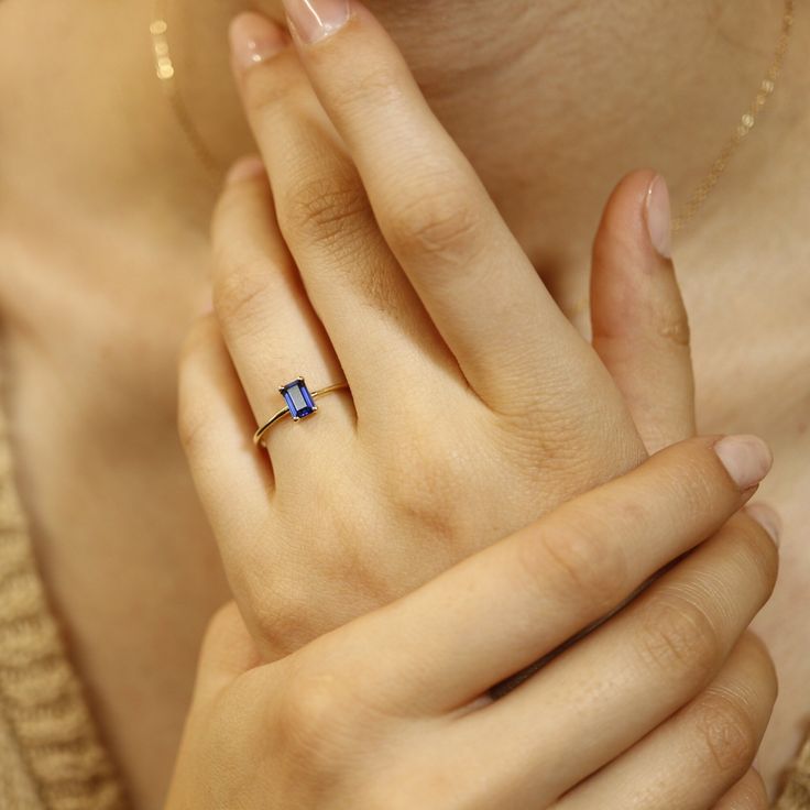 This beautiful Sapphire Gold Ring was handmade in Melt'm Jewelry Design Studio in California using 14k solid yellow gold band and 6x4mm emerald cut lab grown sapphire stone. Sapphire is featuring in 14k gold prong setting. DETAILS ABOUT THE RING, MATERIAL AND STONES Ring Band: 14K solid gold Ring Band size: 1.2 mm thick Gemstone: Lab grown Sapphire Sapphire size: 6mm x 4mm emerald cut Yellow gold or white gold options available from drop down menu. *** All our raw materials are sourced from US-b Emerald Cut Sapphire Solitaire Promise Ring, Emerald Cut Solitaire Sapphire Promise Ring, 14k Gold Emerald Cut Promise Ring, 14k Gold Sapphire Ring With Asscher Cut For Promise, Minimalist Emerald-cut Ring With Tension Setting, Minimalist Emerald Cut Ring With Tension Setting, 14k Gold Asscher Cut Sapphire Promise Ring, 14k Gold Sapphire Ring For Promise With Asscher Cut, Dainty Emerald Cut Solitaire Birthstone Ring