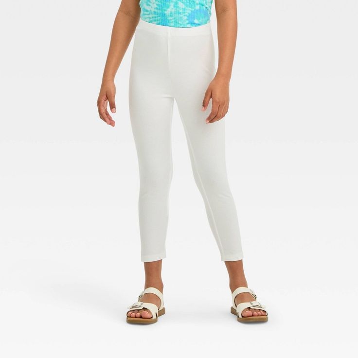 Whether she's taking a stroll in the park or surfing through the library, your young girl will stay as comfy as can be in the Capri Leggings from Cat & Jack™. Designed with her comfort in mind from a breathable fabric with added spandex, these girls' capri leggings feel soft against her skin and offer her stretchy comfort in all her leisurely pursuits. The full elastic waistband provides her a secure fit, while the comfortable mid-rise fit and capri length make them a great pair for layering und Stretch Footless Leggings For Playwear, White Stretch Activewear For Play, Spring Stretch Activewear For Play, White Non-stretch Casual Leggings, Stretch Activewear For Spring, Playful Spring Leggings For Playwear, Playful Spring Playwear Leggings, Playful Stretch Leggings For Spring, Playful Spring Stretch Leggings