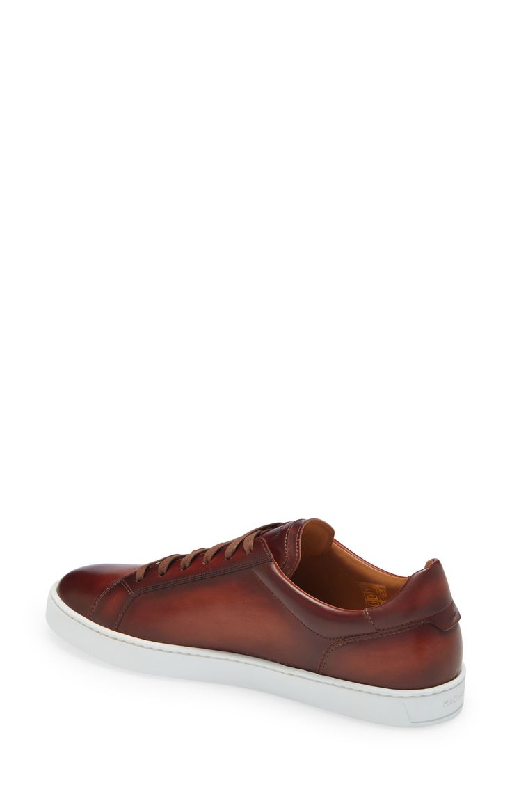 The rich glow of burnished Italian leather elevates a charming handcrafted sneaker in a sporty low-top silhouette. Leather upper and lining/rubber sole Made in Spain Sneaker Men, Italian Leather, Cognac, Low Top, Top Sneakers, Slip On Sneaker, Rubber Sole, Leather Upper, Spain