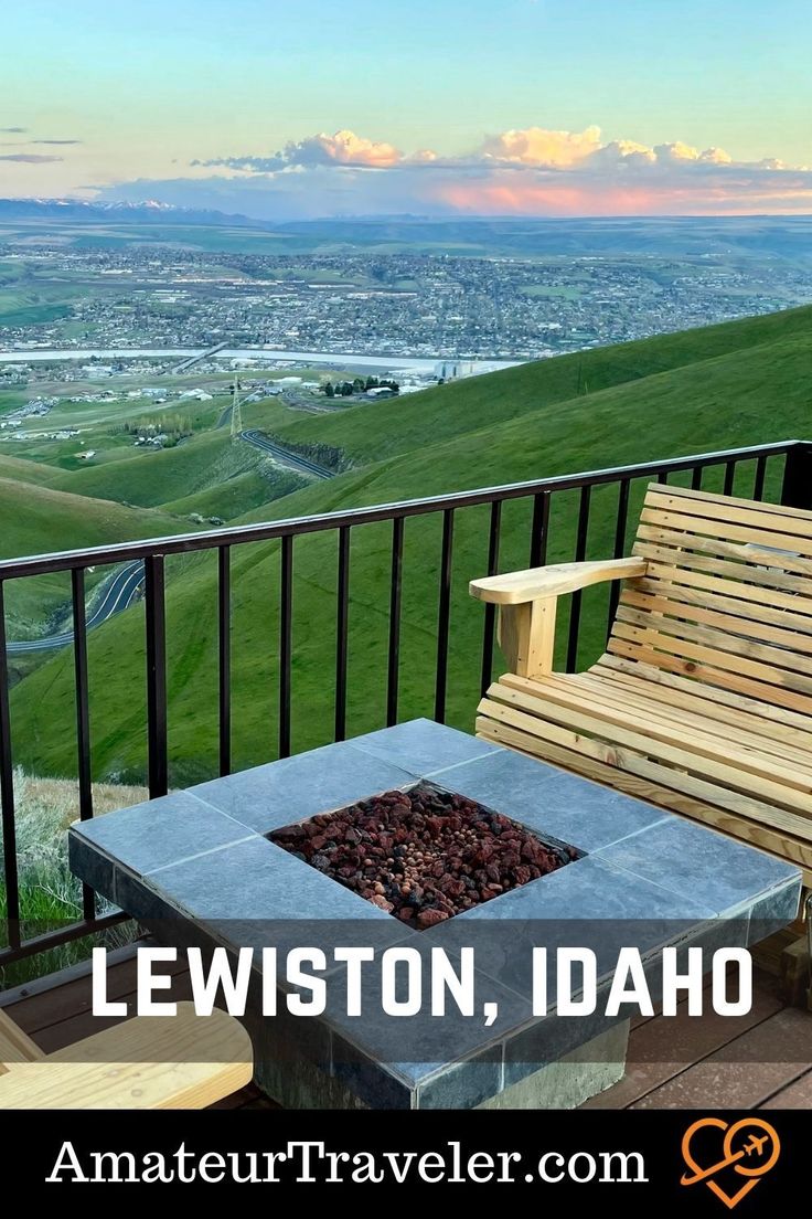 a wooden bench sitting on top of a balcony next to a fire pit