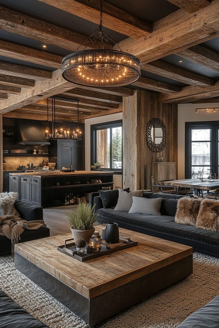 a living room filled with furniture and a chandelier hanging over the top of it