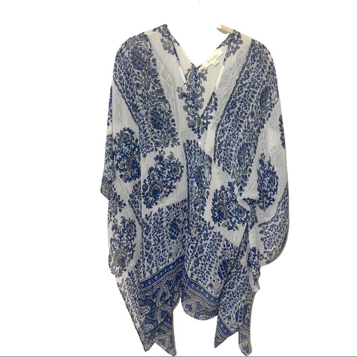 Two By Vince Camuto Sheer White Blue Kimono Poncho Cover-Up Top. White With Blue And Black Paisley Floral Print. Polyester. Size Extra Small / Small. New Without Tags. Perfect For A Swim Cover-Up As Well. Great With Shorts Or White Pants Too ! Vacation Resort Wear Blue Bohemian Kimono For Daywear, Bohemian Blue Kimono For Daywear, Casual Long Sleeve Kaftan One Size, Blue Poncho For Beach In Spring, Blue Poncho For Vacation In Spring, Spring Blue Wrap Kaftan, Blue Poncho For Spring Vacation, Blue Casual Poncho For Vacation, Casual Blue Poncho For Vacation