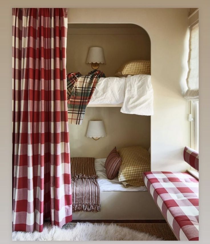 two bunk beds with red and white checkered curtains