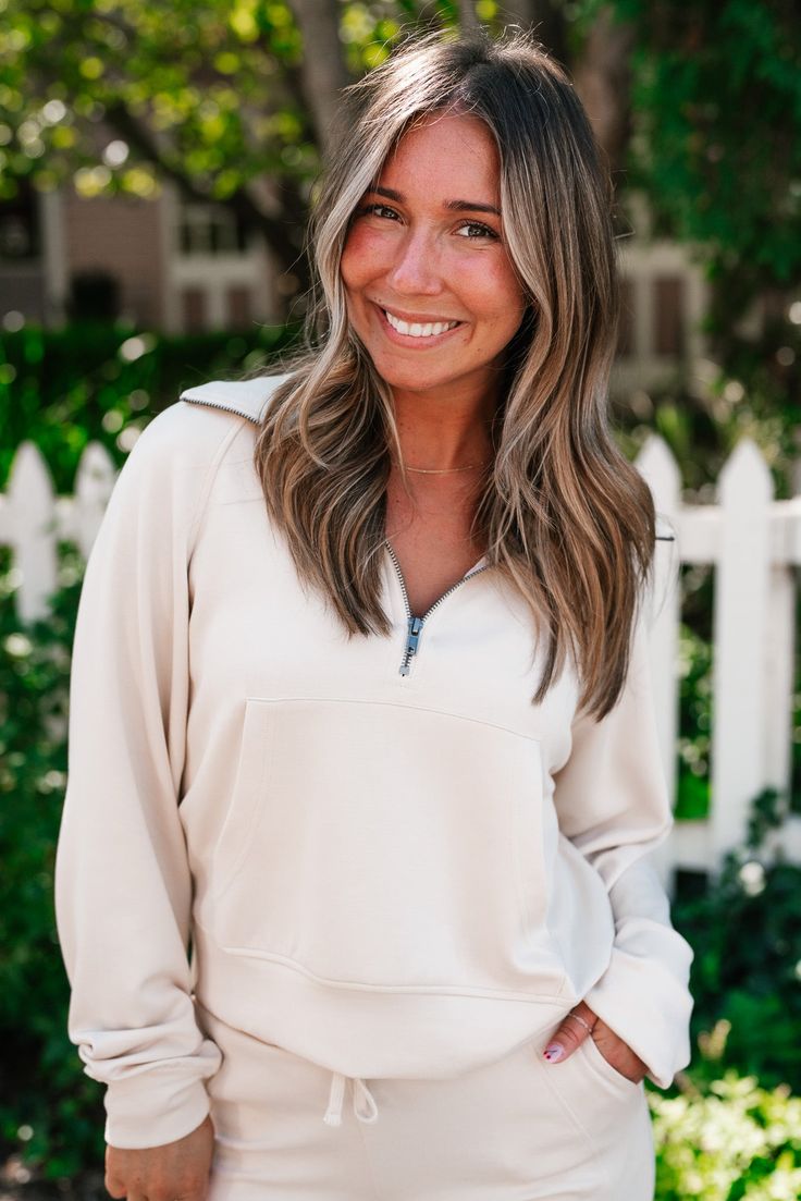 Introducing the End Of Summer Quarter Zip Top in Cream—the perfect transitional piece for those cooler days ahead. Featuring a classic quarter-zip design, this top blends style with functionality. The wide front pocket adds a casual, sporty touch, while the slight cropped fit keeps it modern and flattering. Whether you're layering it over a tank or pairing it with your favorite high-waisted jeans, this top is the ultimate mix of comfort and style. Stay cozy and chic as the seasons change with th Spring Half-zip Athleisure Sweatshirt, Sports Half-zip Sweatshirt With Ribbed Cuffs, Athleisure Half-zip Outerwear With Zipper Closure, Versatile Half-zip Sweatshirt With Ribbed Cuffs, Athleisure Half-zip Sweatshirt With Zipper Closure, Loungewear Dresses, Zip Design, Seasons Change, Casual Sporty